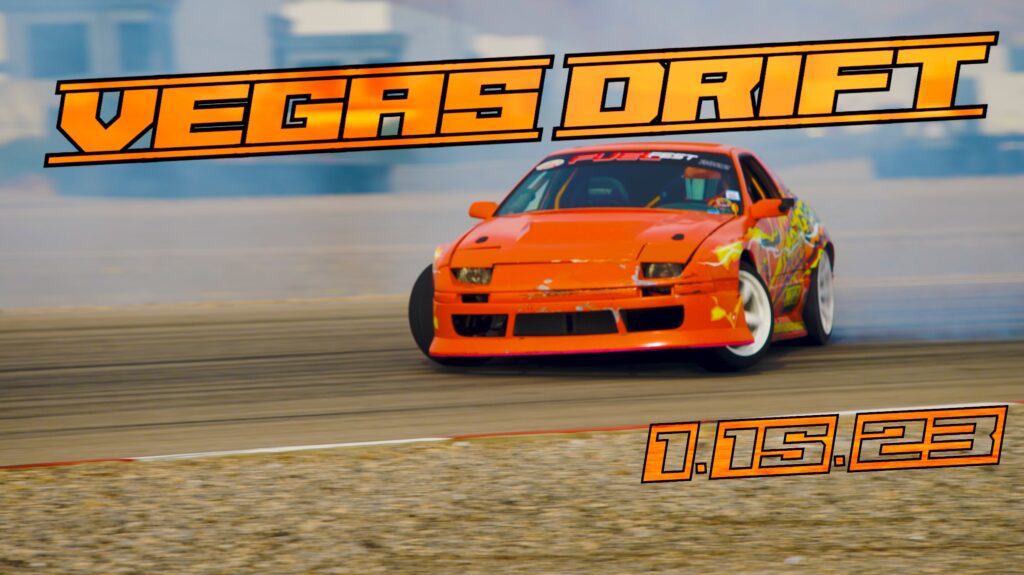 an orange sports car is drifting somewhere in the desert