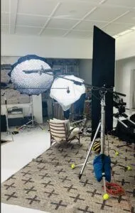 professional interview lighting setup with lights, c-stands, softboxes, boom poles, mic