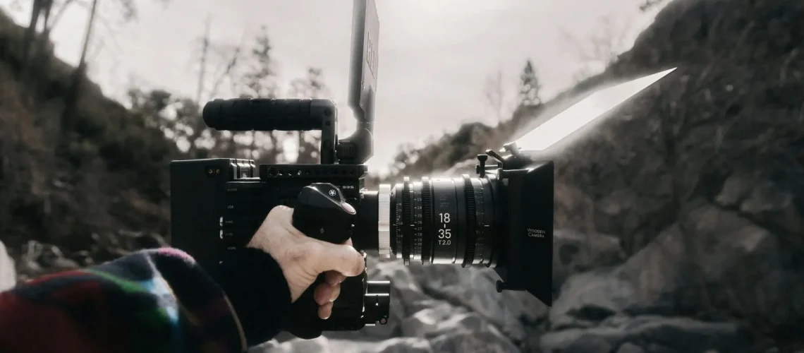 A HUSTL Media crew holding a professional camera