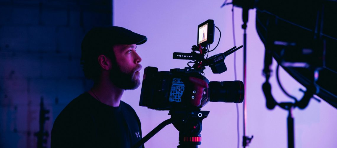 A videographer focusing on the video content and storytelling in plan