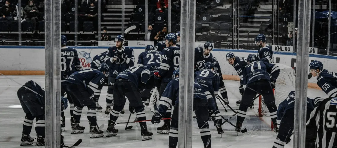 Hockey players actively playing in the stadium