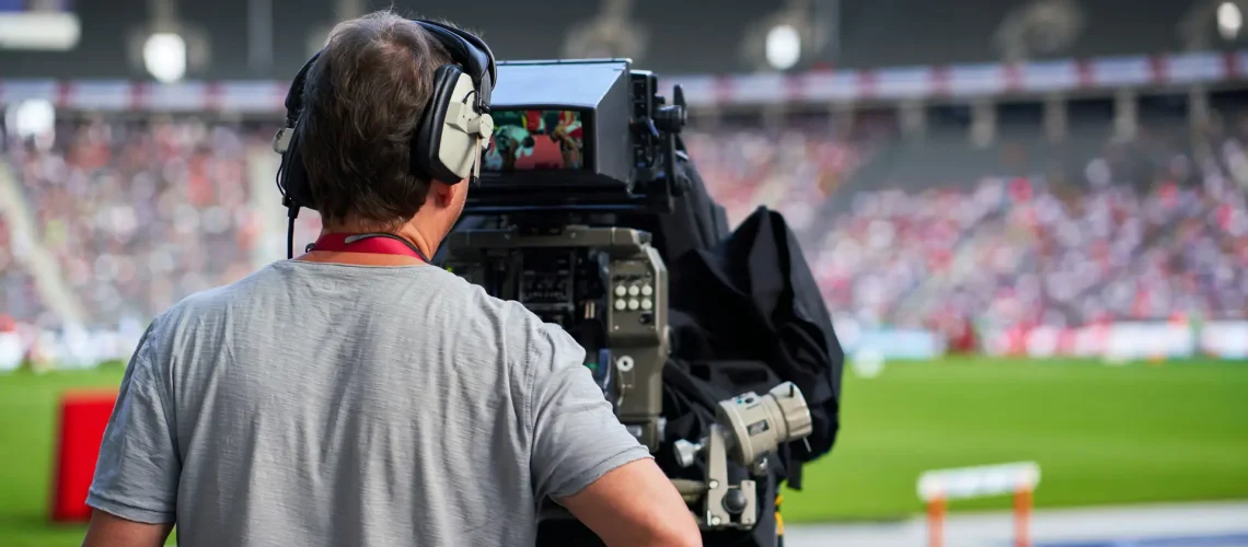 A videographer capturing the live actions in a soccer game