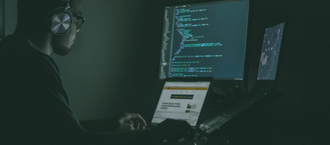 A man working in IT and prone to cybersecurity attacks