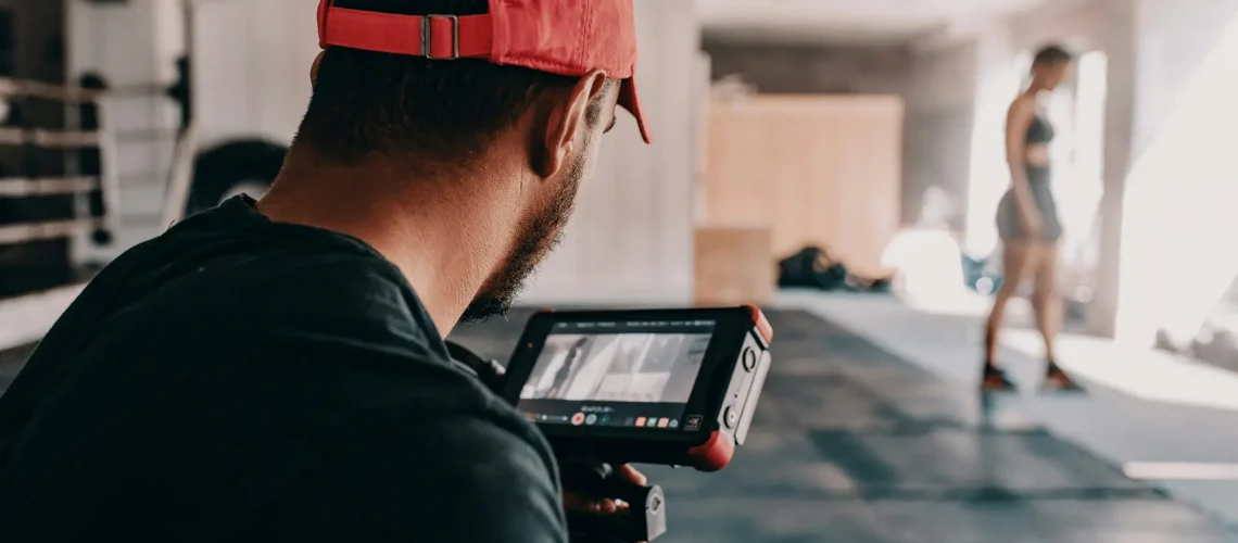 A videographer shooting a practice routine of a UFC fighter