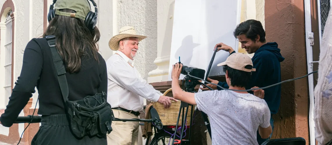 Video production team working outdoors from storyboard