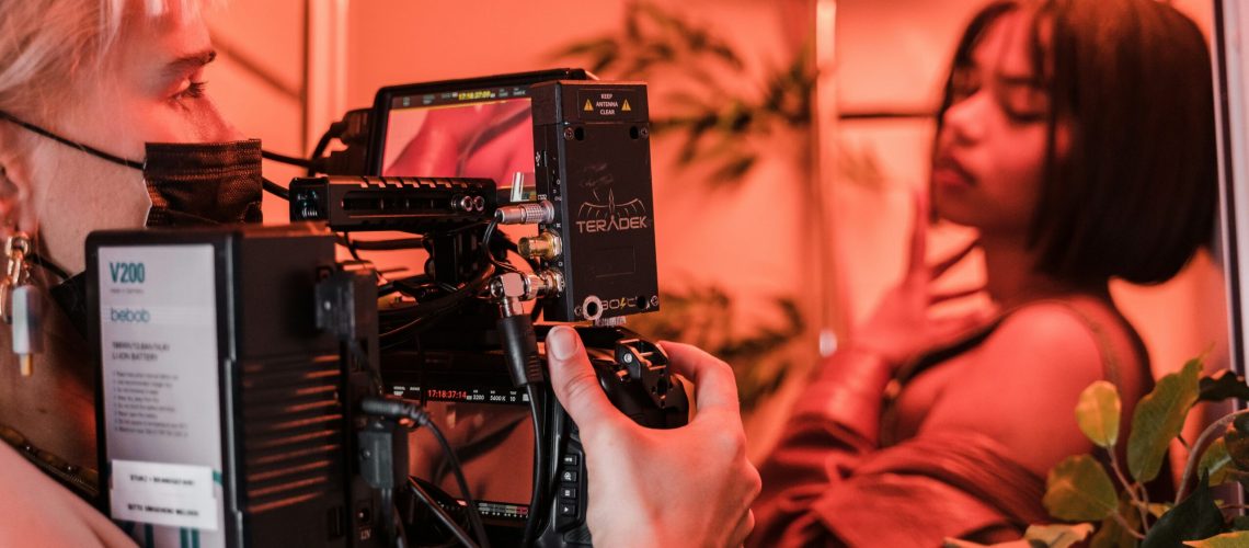 Woman videographer shooting for an advertisement