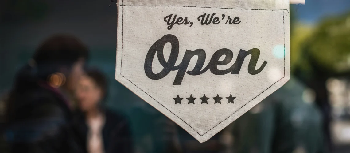 Open banner sign for a small business