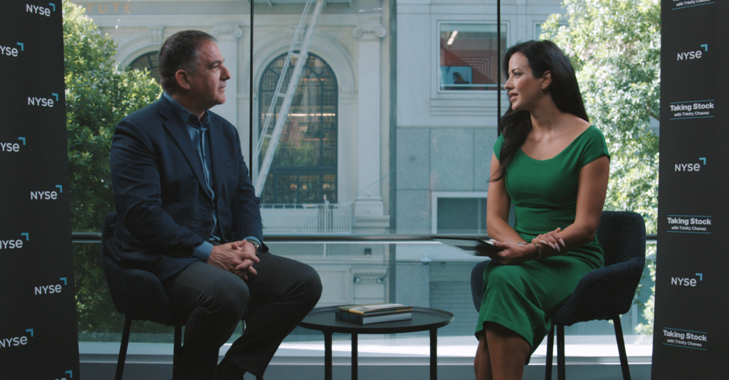 a man and a woman sit opposite other during a professional interview