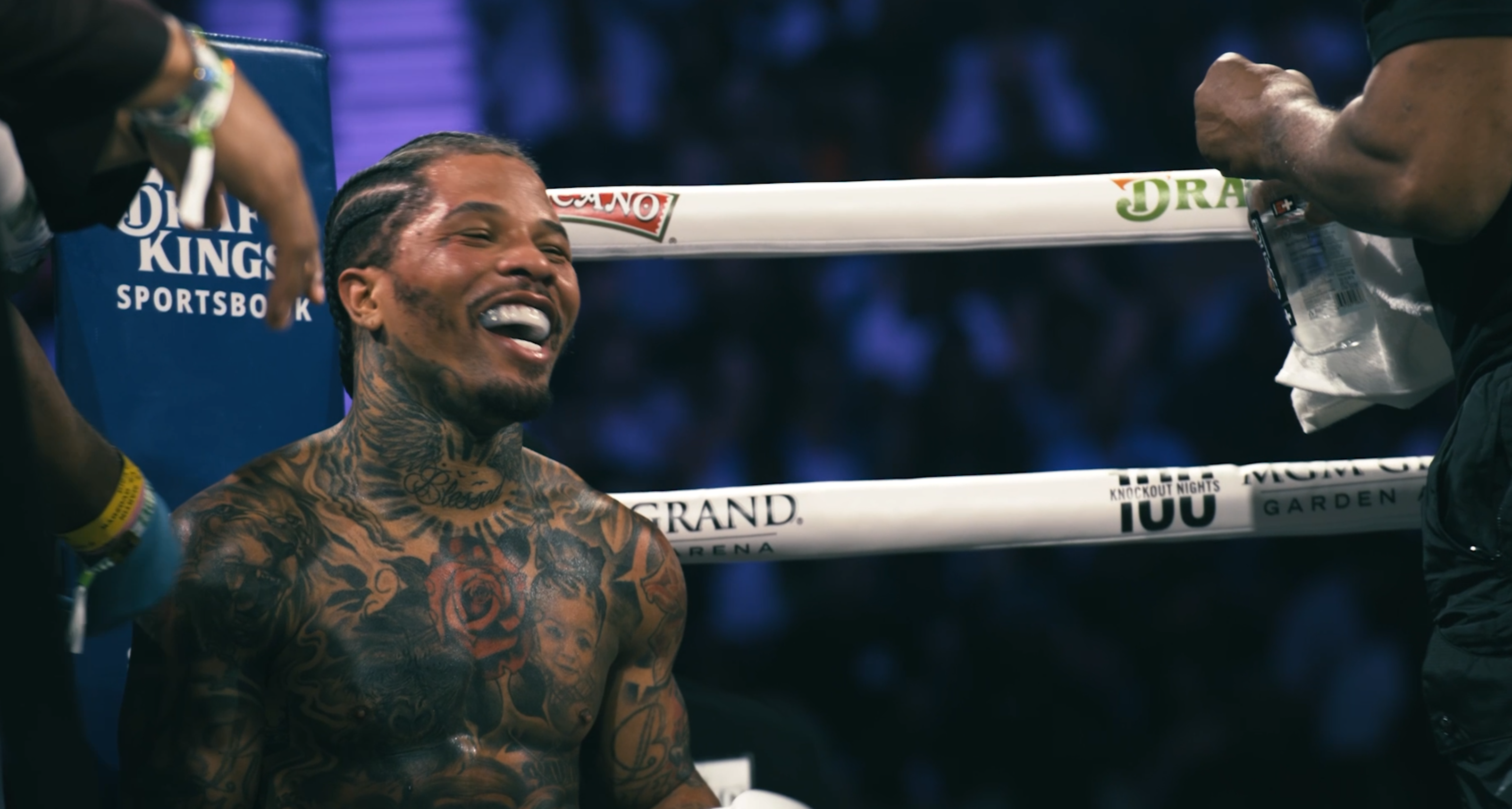 Professional boxer Gervonta Davis in the ring sitting on a chair smiling in between rounds