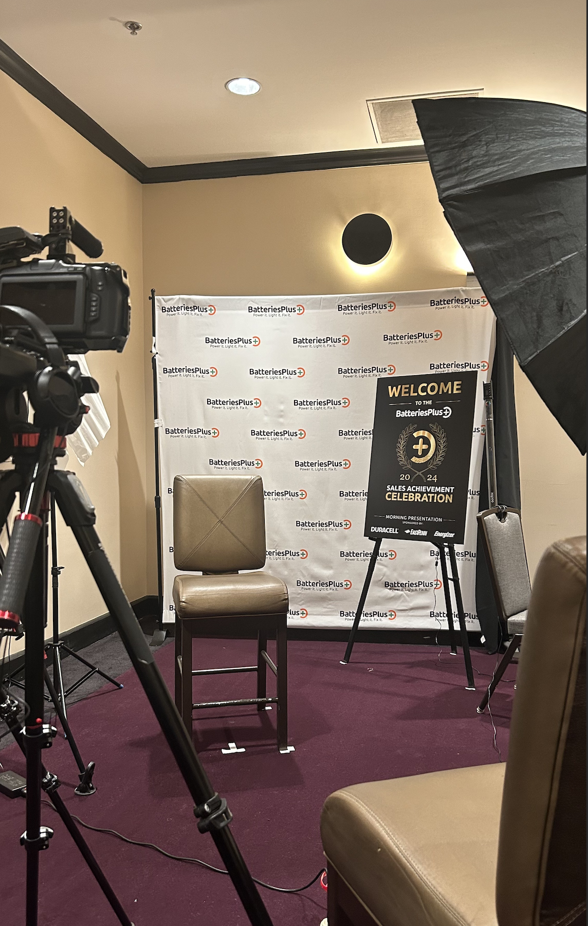 a professional interview setup with a backdrop for the client