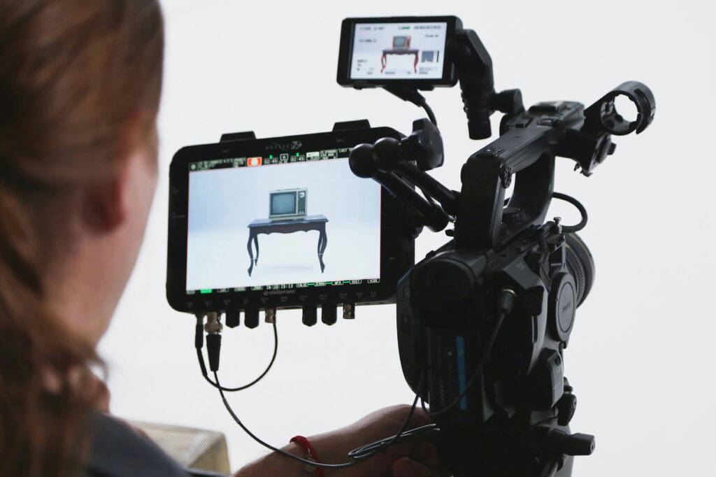 Video production using two screens to capture the correct subject