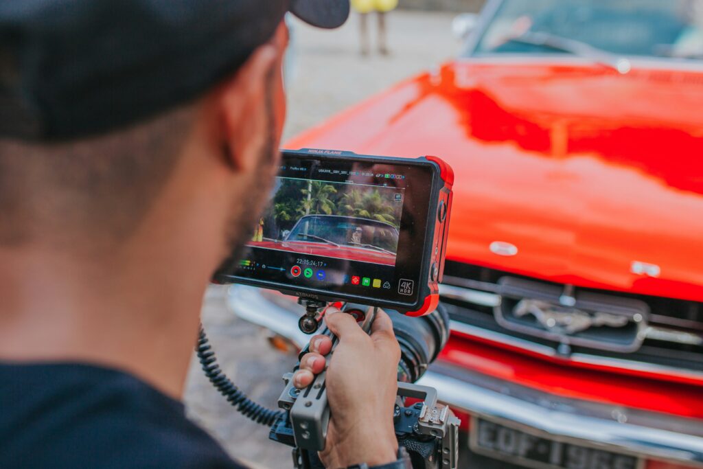 Man framing the color and shape in a camera