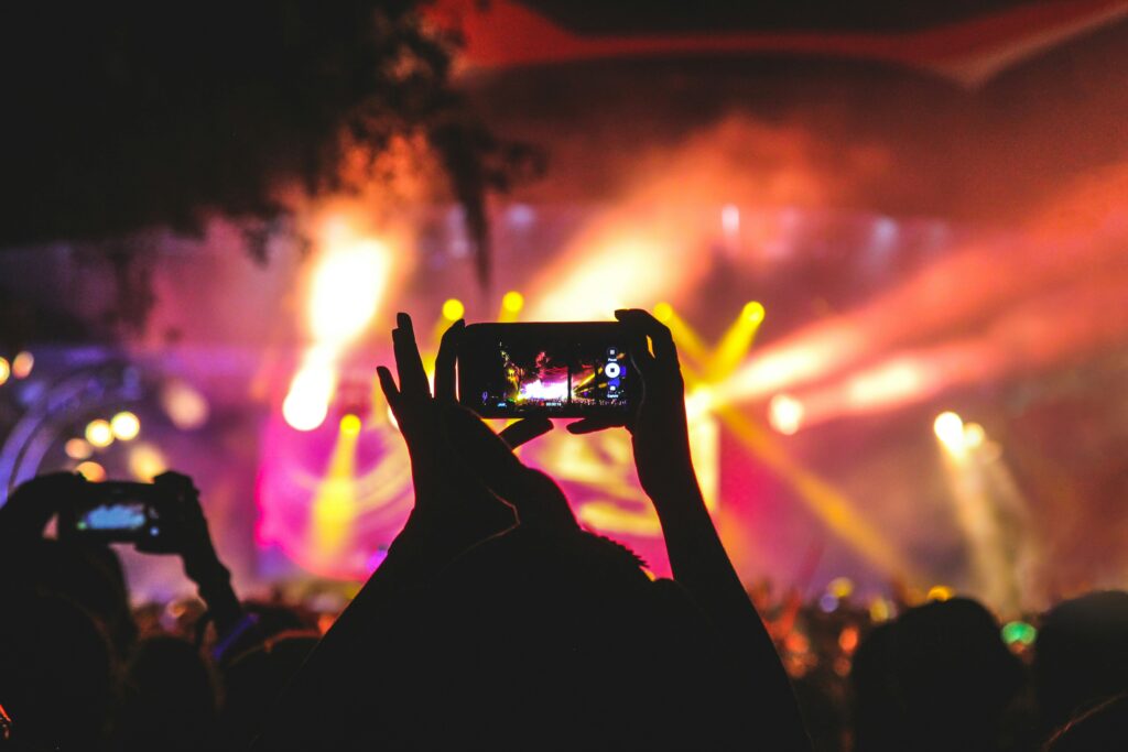 Woman recording an event for her social media