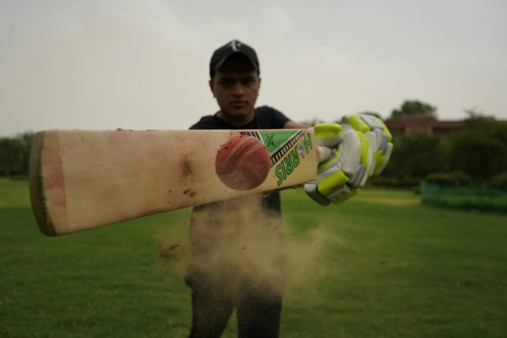 Boy hitting a ball with impact