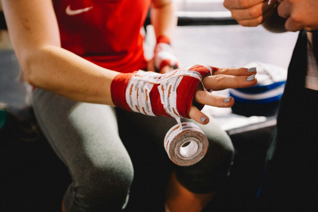 Securing gloves before the UFC fight