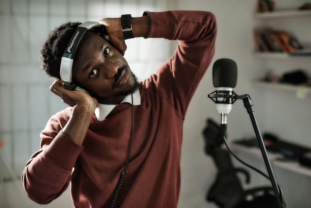 A man performing voice recording for a video production