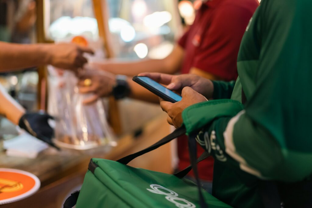 A Grab food delivery picking up an order from a small business