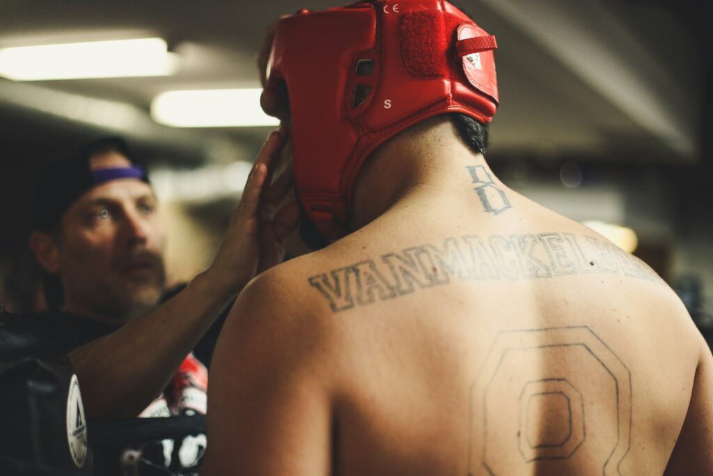 A UFC fighter showing his back on to the camera