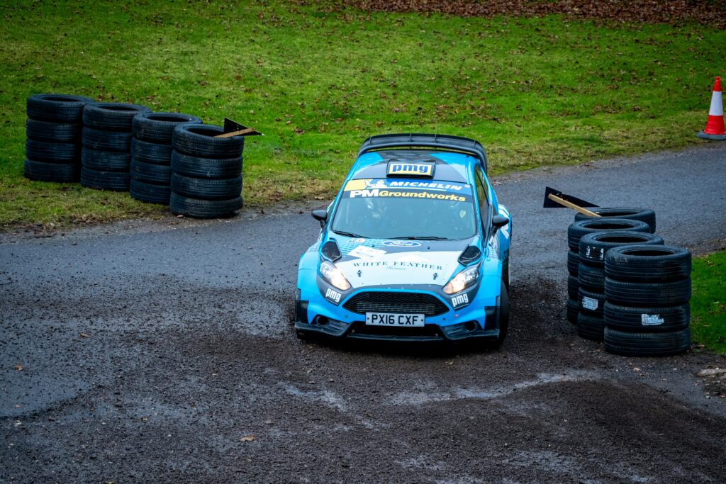 A race car parked in the middle of a course for exhibition