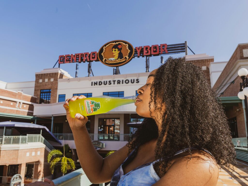 A woman brand ambassadress promoting a drink product