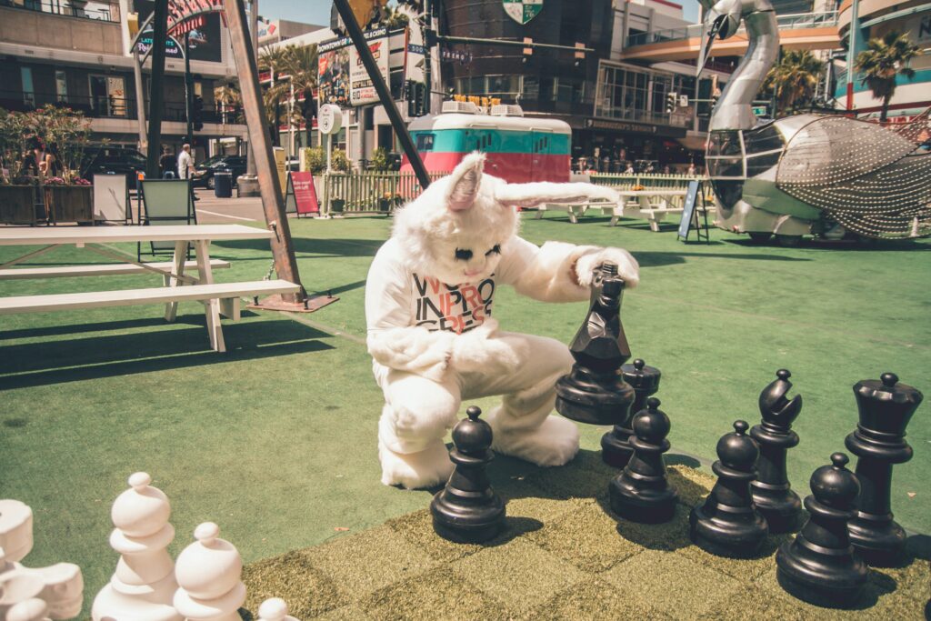 Bunny character playing chess for audience