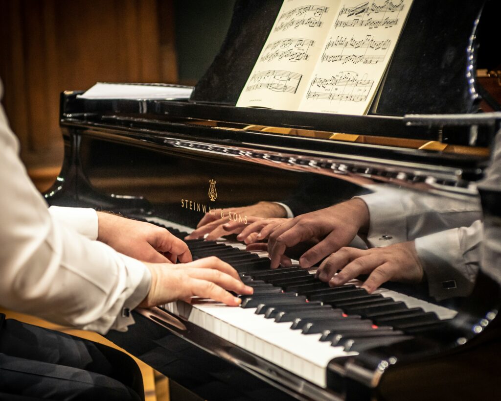 Pianists showcasing their skill in playing piano