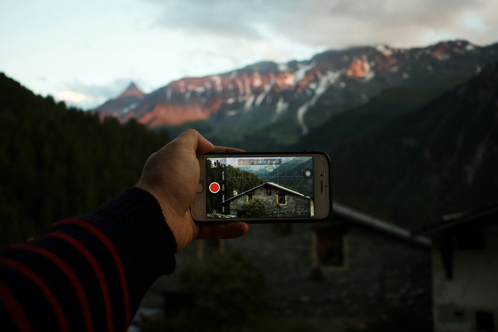 A phone used to record a view near the mountains