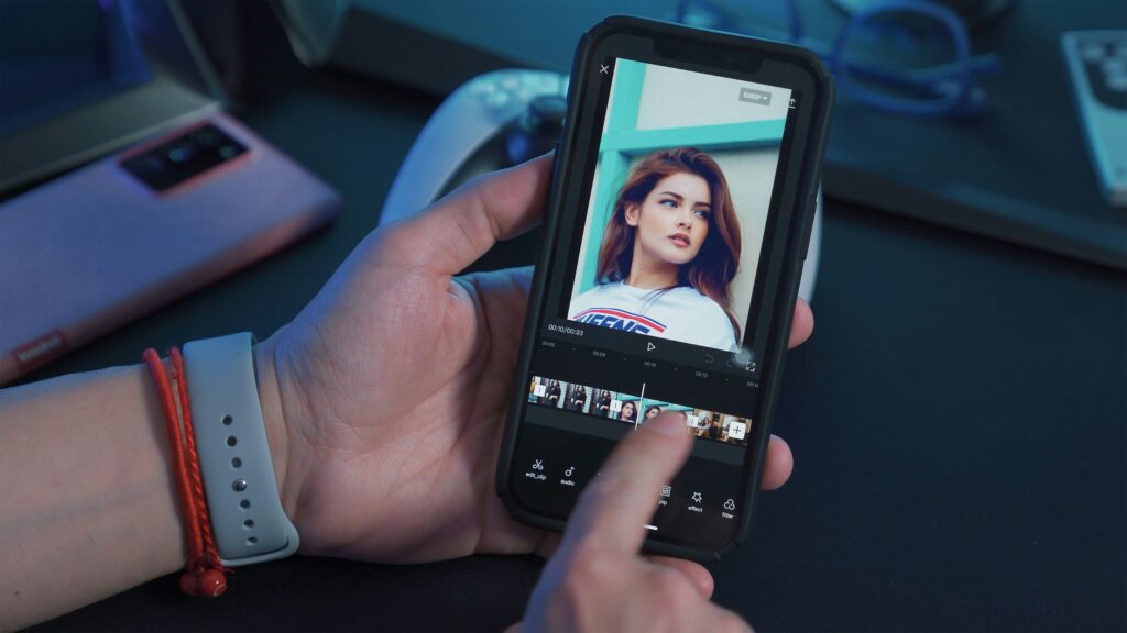 A camera crew showing a sample photo of the model