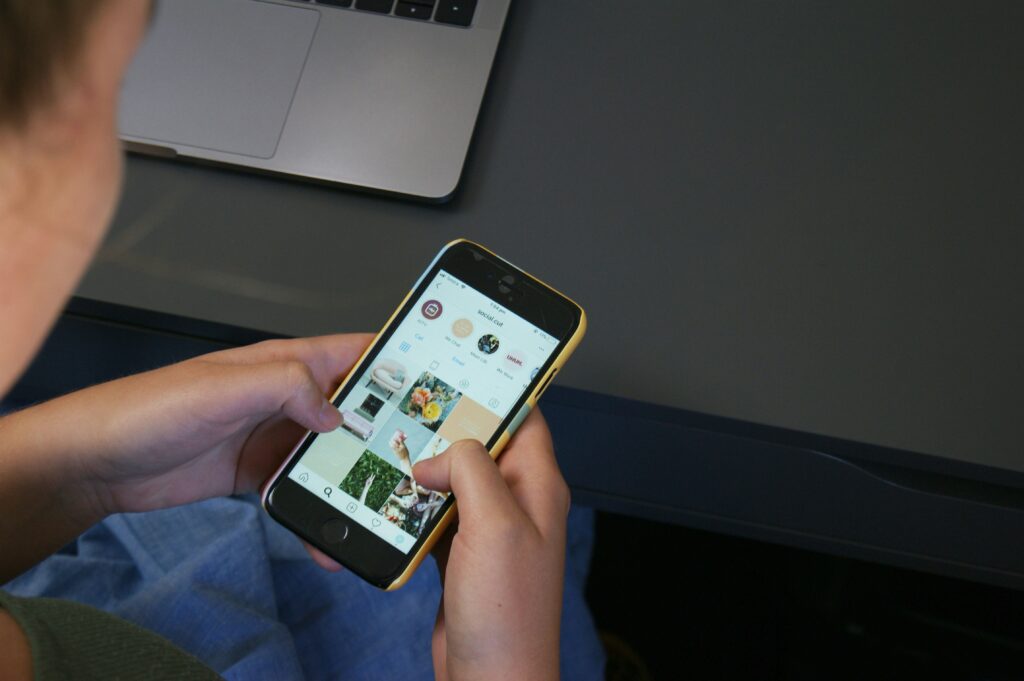 A social media user browsing content in a mobile phone