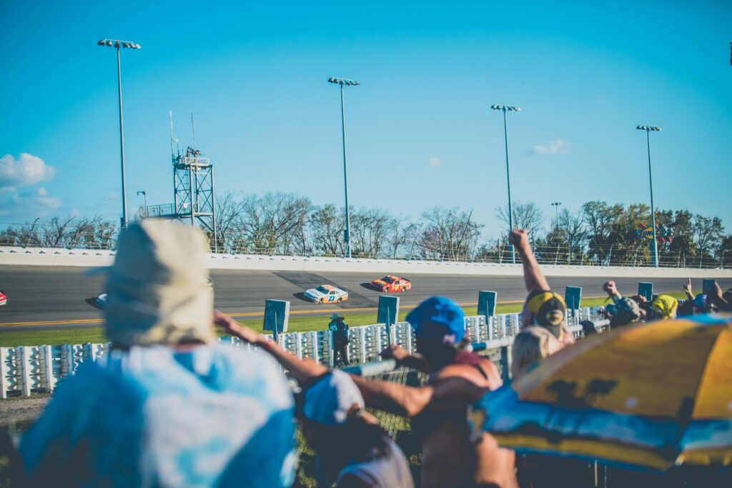 Pople watching from the side of the arena for enjoyment