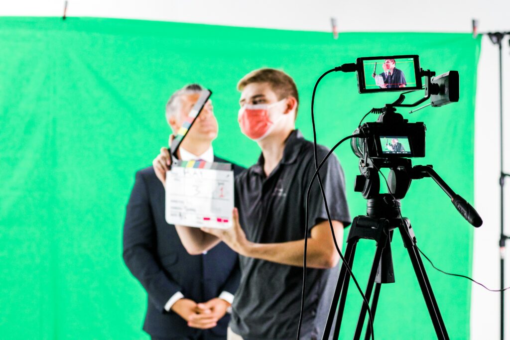 A video production crew queuing the next scene