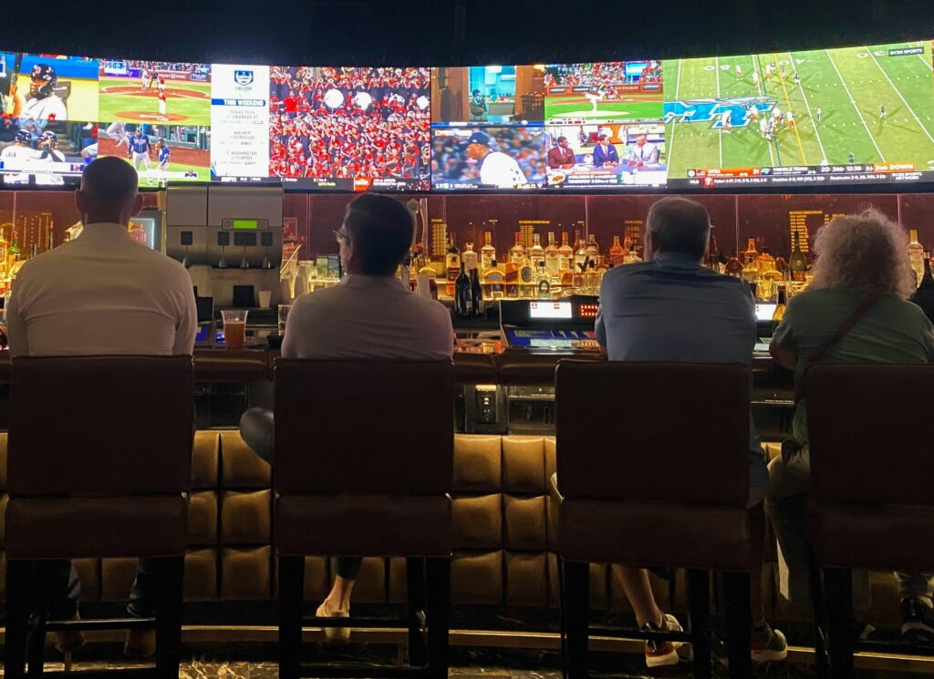 Sports fan watching multiple sports in different screens