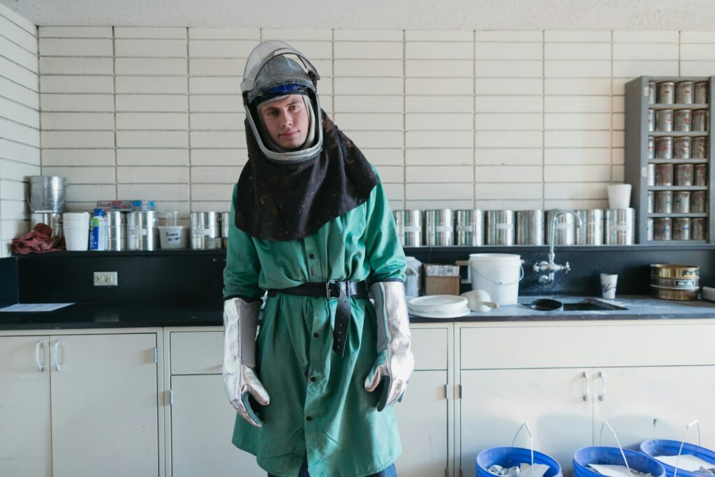 Safety training video actor wearing a laboratory gown as an example