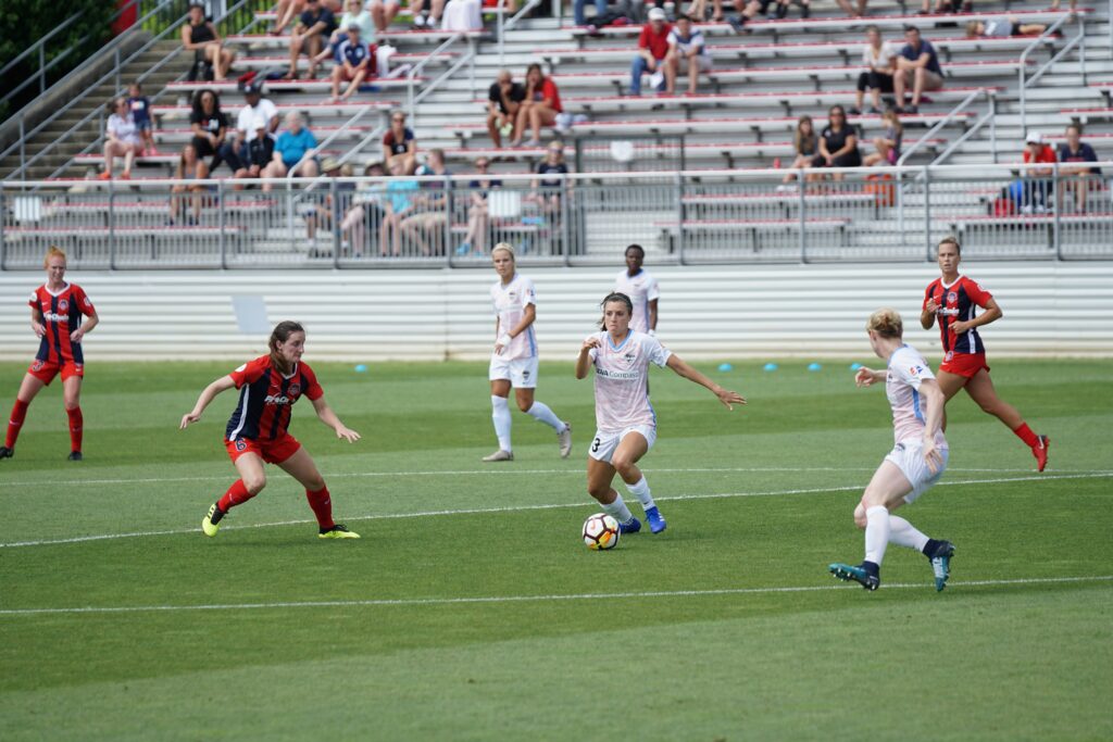 A wild soccer game captured in a spotlight