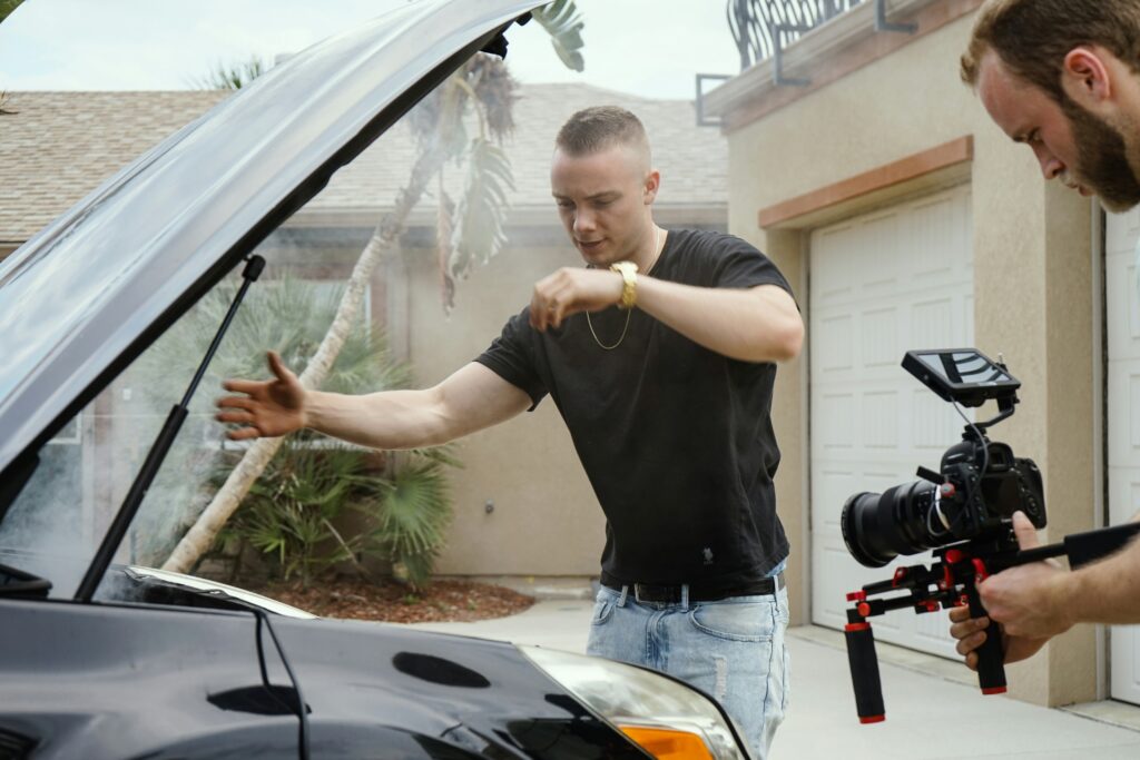 A man showing the insides of a car for a commercial