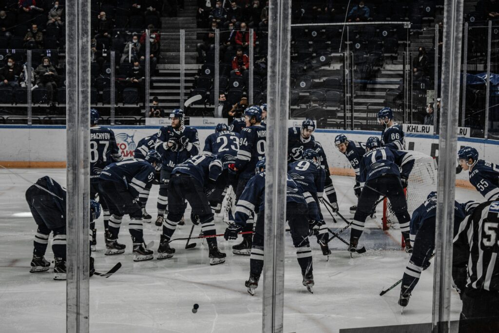 Hockey players actively playing in the stadium