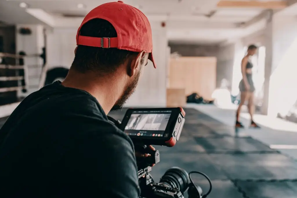 A videographer shooting a practice routine of a UFC fighter