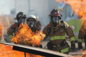 Firefighters working on a large fire as a safety training practice