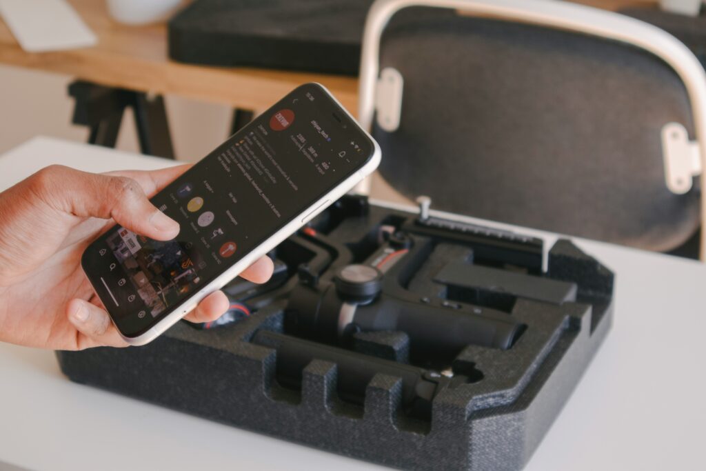 A local crew holding a phone visiting his social media