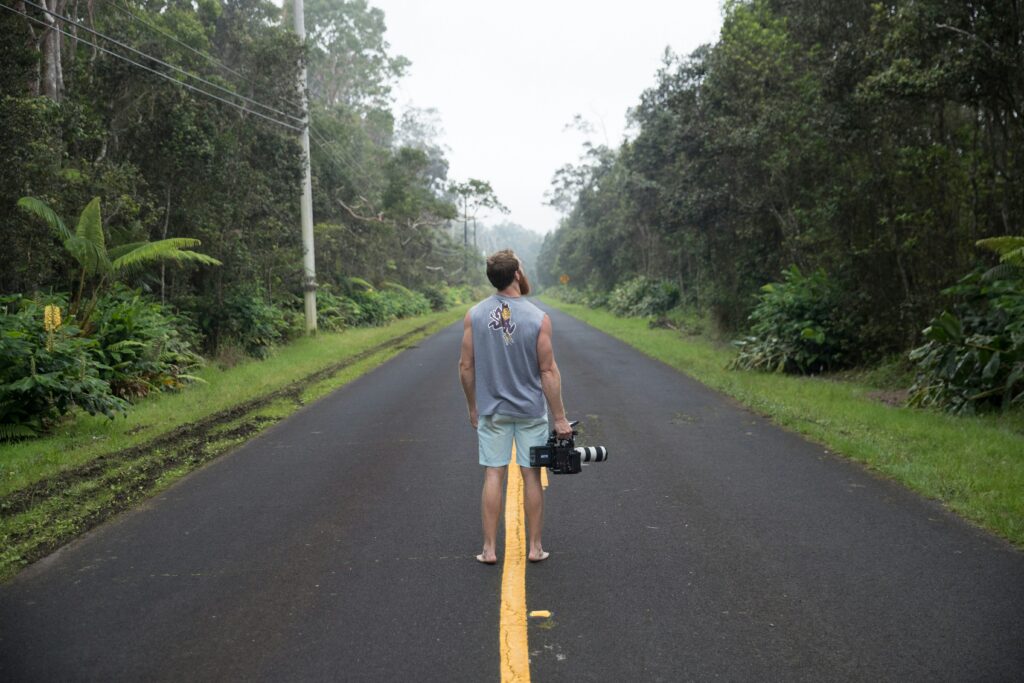 A video production crew in the middle of the road