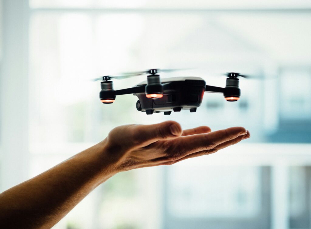 A video production crew working with a drone