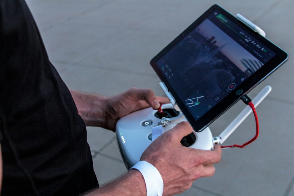 A crew member controlling the drone