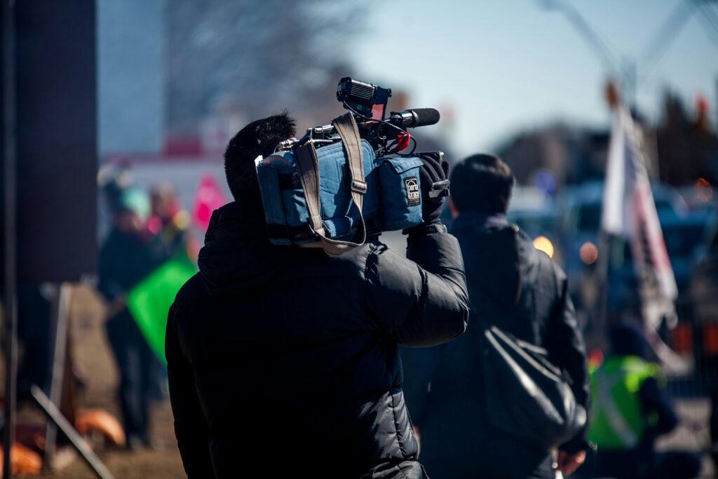 A crew diving into the crowd for video productions