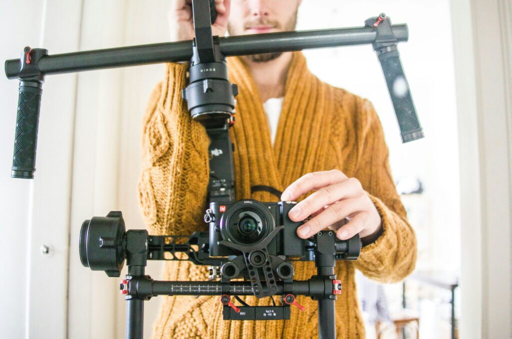 A video production crew fixing the camera