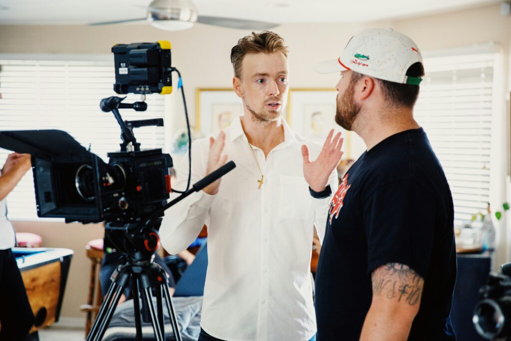 A video production director giving instructions to a staff