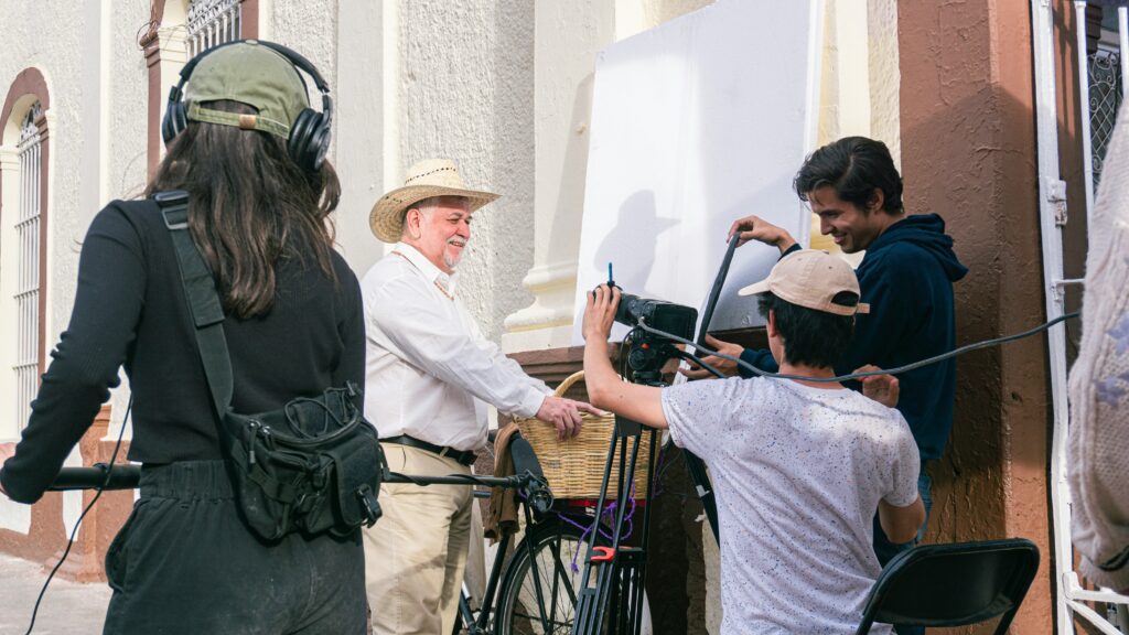 Video production team working outdoors from storyboard